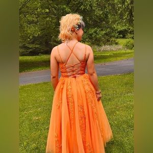 Burnt orange prom gown. Size small. Dress was altered to be ankle length.